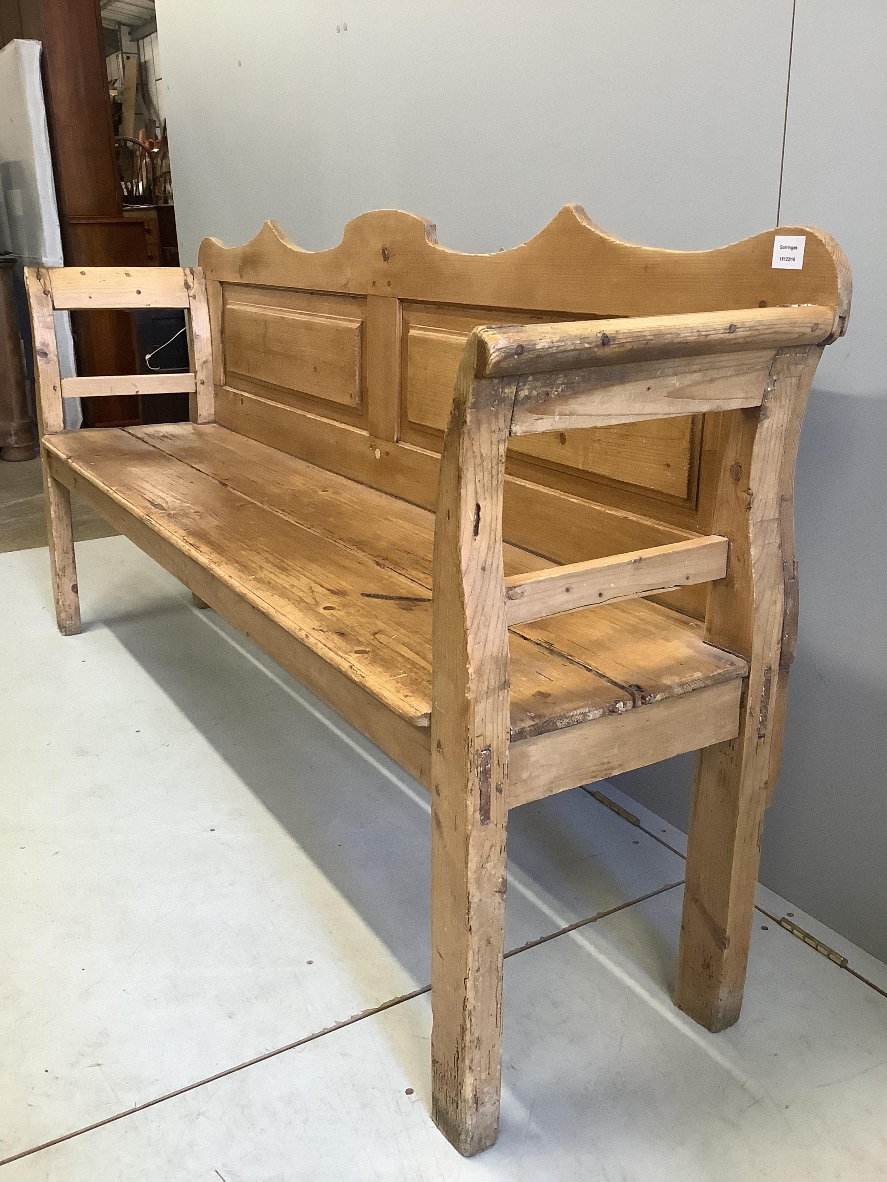 A 19th century pine settle, width 196cm, depth 44cm, height 97cm